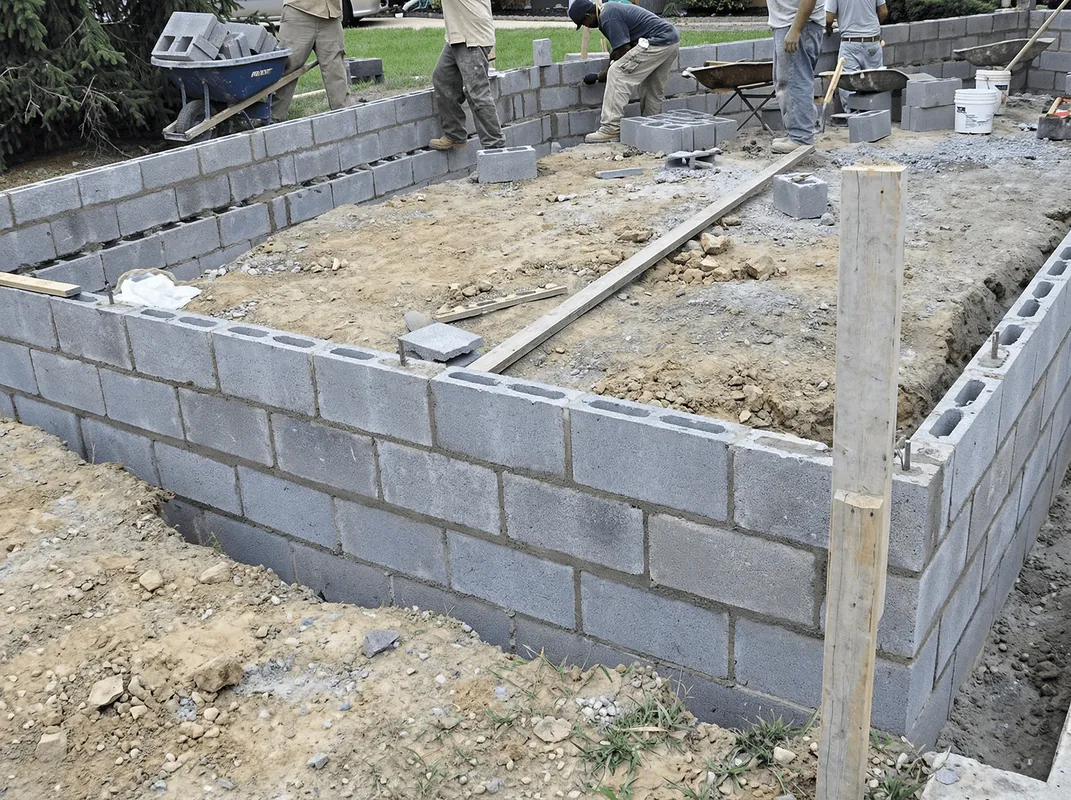 Professionals building a foundation with blocks in Tulsa, OK