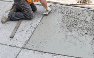 Professional repairing a concrete floor in Tulsa, OK